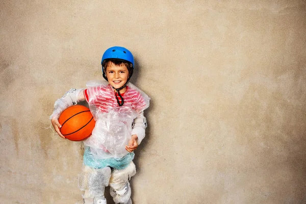 Kid and basketball ball overprotecting bubble wrap — Stock Photo, Image