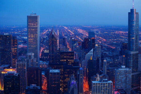 Chicago downtown evening dark time cityscape wide panorama, aerial or bird-eyes view Illinois, USA.