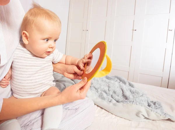 Baby infant boy look at mirror together with mom — ストック写真