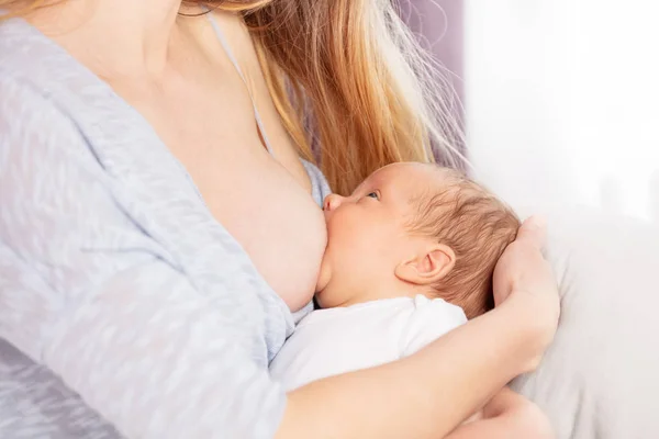 Image of the mother breastfeed little infant boy — Stockfoto