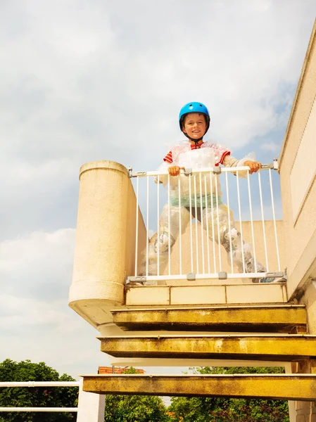 Boy in helmet, bubble wrap near stairs safe door — Stock fotografie