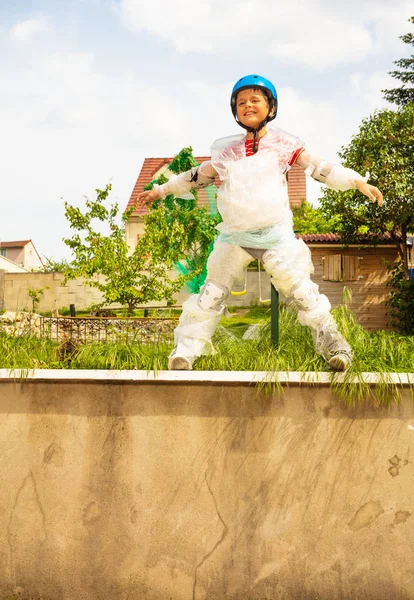 Boy about to jump wear overprotective bubble wrap — Stok fotoğraf