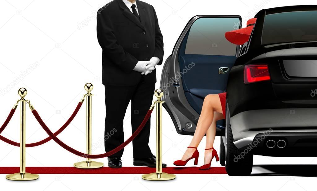 Driver opening black limousine door for women in red dress