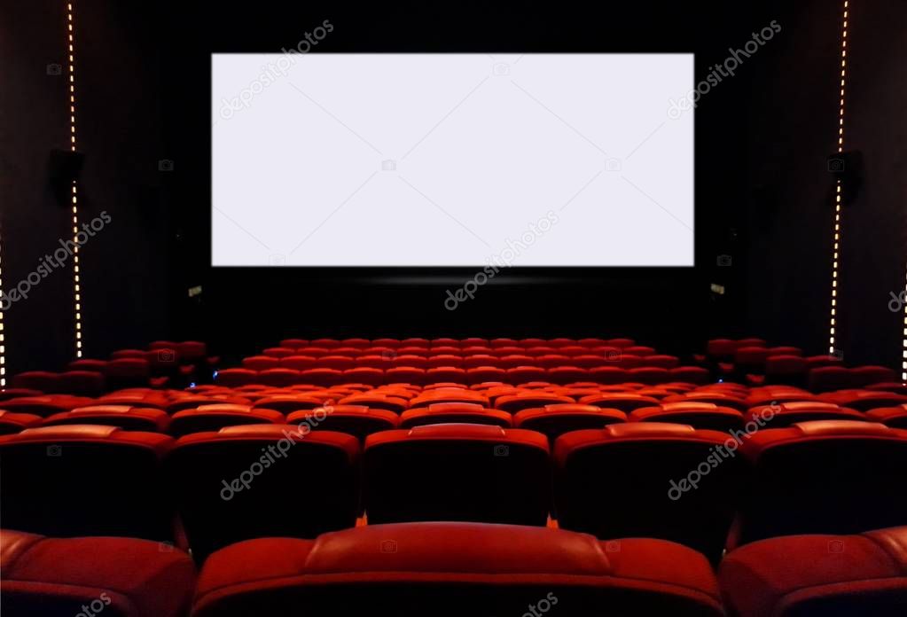 Empty cinema seats with blank white screen