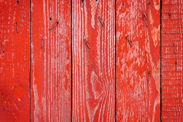 Texture of old wooden fence painted in red — Stock Photo, Image