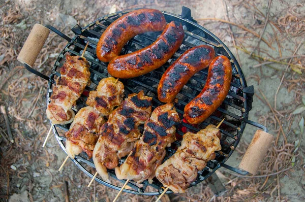 Barbecue grill with meat and sausage — Stock Photo, Image