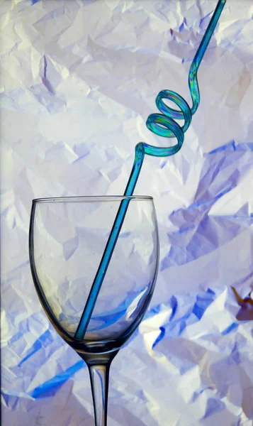 Glass cup with cocktail straw — Stock Photo, Image