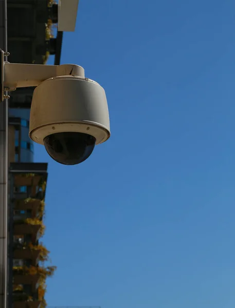 Sunny blue sky and outdoor surveillance camera