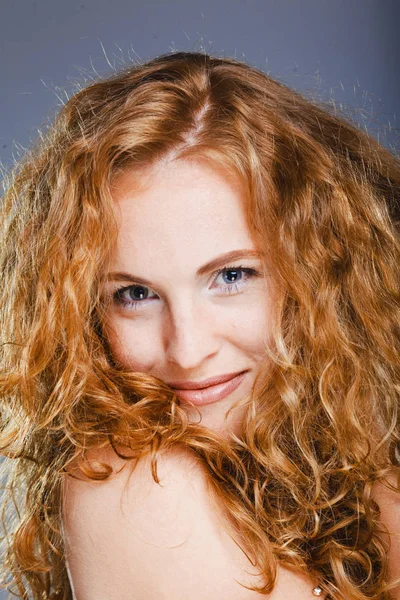 Portrait of beautiful lady on grey. Studio shot — Stock Photo, Image