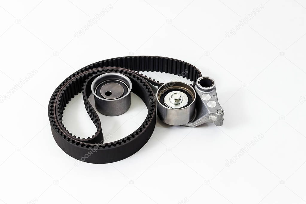Kit of timing belt with rollers on a white background isolated. Auto Parts. Spare parts.
