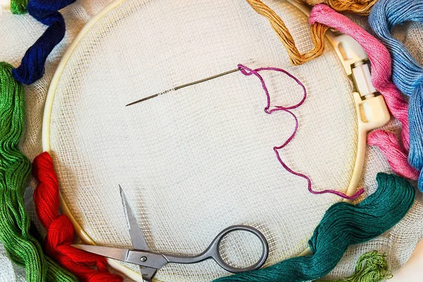 Embroidery. Sewing accessories. Canvas, hoop, thread mouline. — Stock Photo, Image