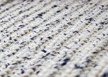 Gri arka plan ördü. Örme doku. Örgü örneği. 