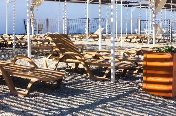 Beach loungers under a canopy — Stock Photo, Image