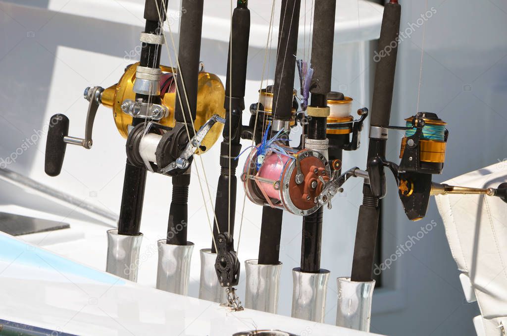 Closeup of a variety of sports fishing reels used in deep sea fishing on a fishing charter boat.