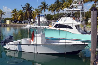 Charter sport fishing boats with tuna tops docked at a Key Biscayne,Florida marina. clipart