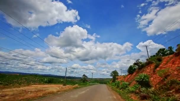 Country road to horizon past scooter — Stock Video