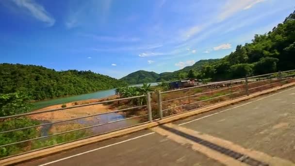 Barriers on road against hilly rural landscape — Stock Video