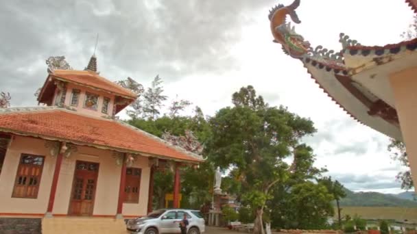 Buddhist temple complex up stairs to decorated pagoda — Stock Video