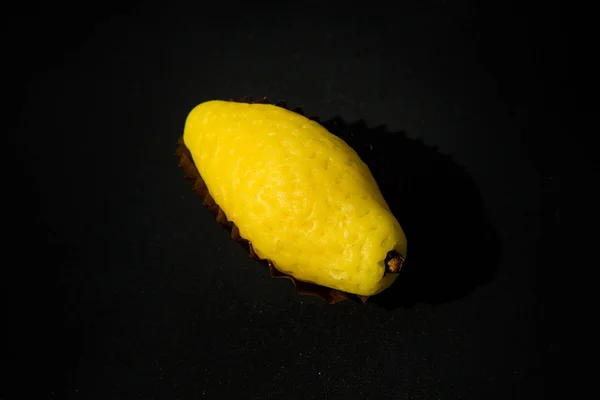 small yellow lemon candy made from marzipan