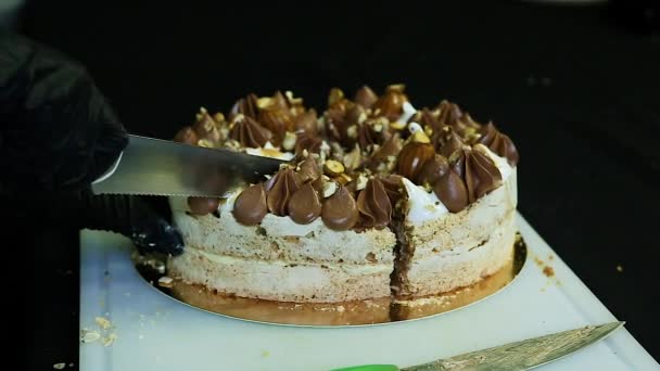 Confectioner hands cut by knife double layer Kiev cake — Stock Video