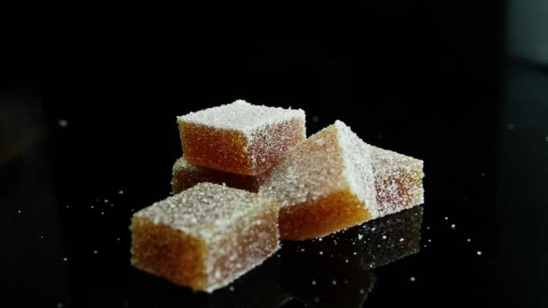 Closeup Marmalade Piece Falls Scattered Orange Marmalade Group Coated Sugar — Stock Video