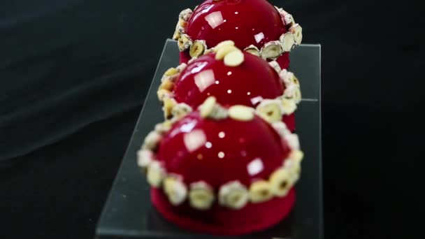 Focus Three Mousse Dessert Decorated Dried Bananas Coated Red Glaze — Stock Video