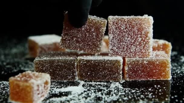 Confectionery Hand Builds Pyramid Orange Marmalade Coated Sugar Black Mirror — Stock Video