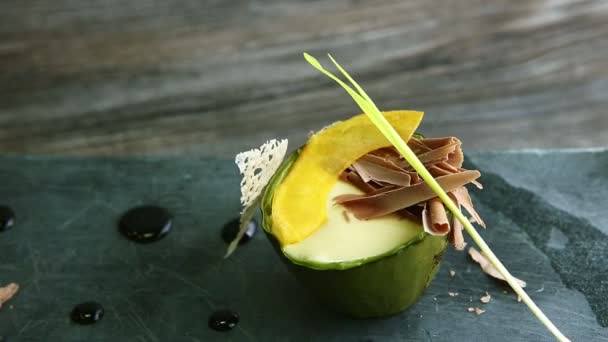 Finely decorated dessert of baked avocado spinning around — 비디오