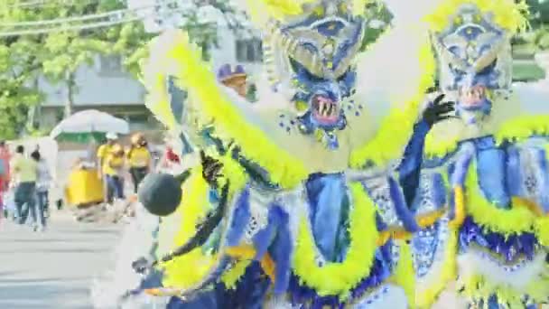 Closeup people in demon costumes dance on dominican city street at annual carnival — 비디오