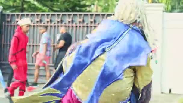 Closeup person in original costume dances on city street at dominican carnival — Stock Video