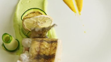closeup plate with finely decorated fish dish spinning around