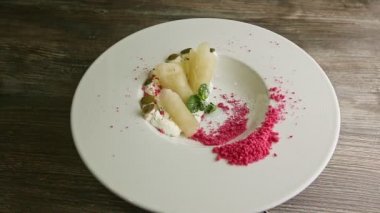 top view on trendy decorated tasty restaurant dessert spinning around on plate