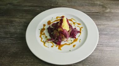 top view on fried meat pieces with mashed potato and sliced red onion