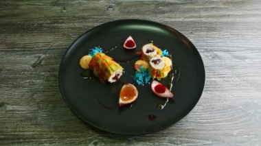 slow zoom in at modernly decorated vegetable rolls stuffed with minced meat