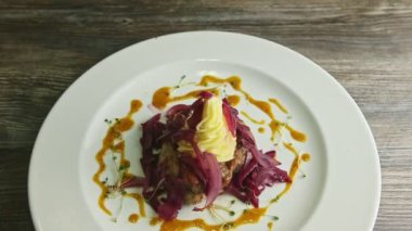 panorama down on fried meat pieces with mashed potato and red onion