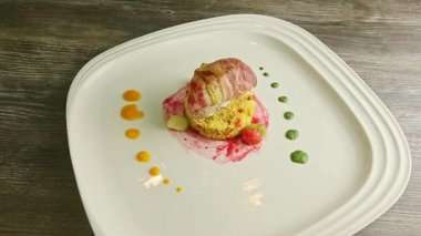 zoom in at delicious meat roll with quinoa and assorted sauces
