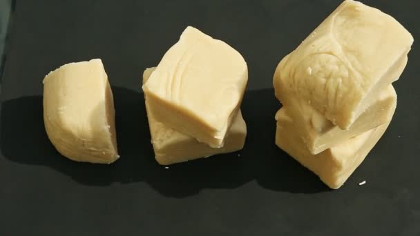 Top view on woman hands take away big cubes of white homemade marzipan mass — Stock Video