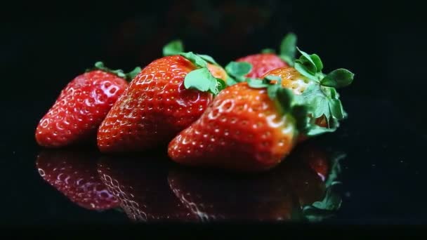 Closeup Focus Group Whole Fresh Juicy Red Strawberries Green Leaves — Stock Video