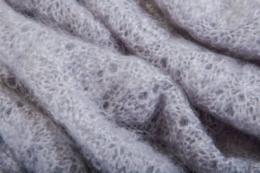 Üst görünüm makro katlanmış el yapımı, gri, ince, kabarık, yün şallı, eski Rus tarzı desenli.