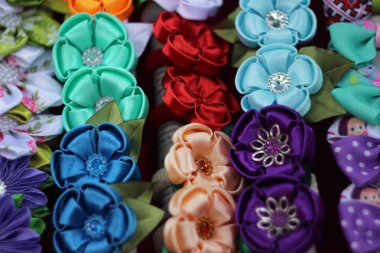 Colorful flowers made of fabric, original hair bands clipart