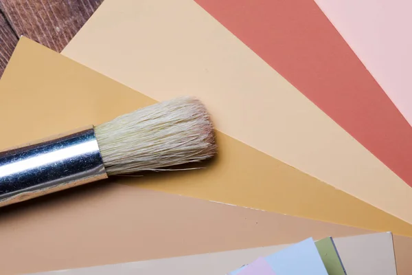 Brush with color samples background — Stock Photo, Image