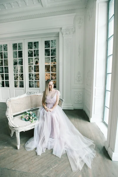 Young women with wedding dress in very bright room, some fine fi — Stock Photo, Image