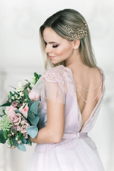 Young women with wedding dress in very bright room, some fine fi — Stock Photo, Image