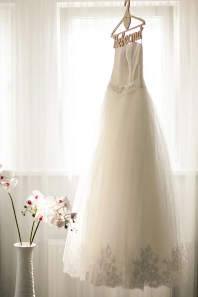 Wedding dress in white light room — Stock Photo, Image