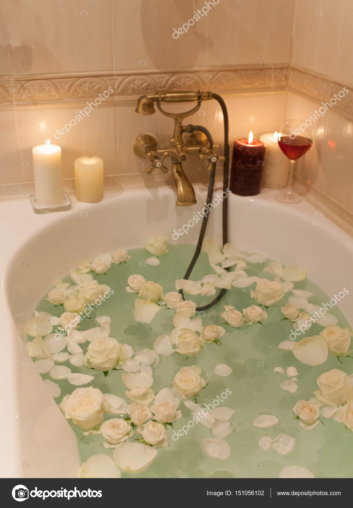Take a bath with rose petals and candles. Romantic evening in th Stock  Photo by ©april_89 151056102