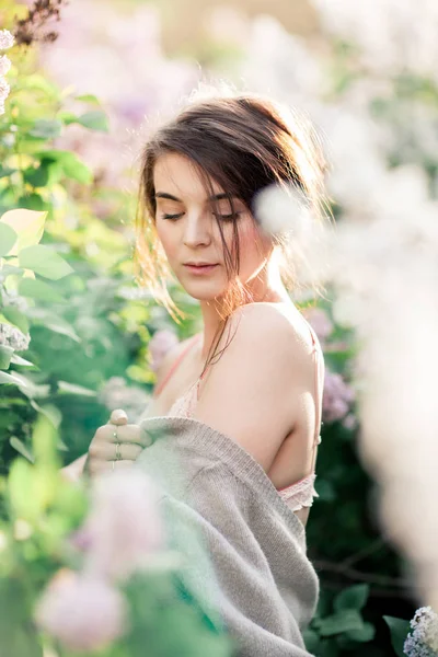 Young Girl in Lace bra Posing in Blossomed Lilac. Sunset tunes. Tender Mood — Stock Photo, Image