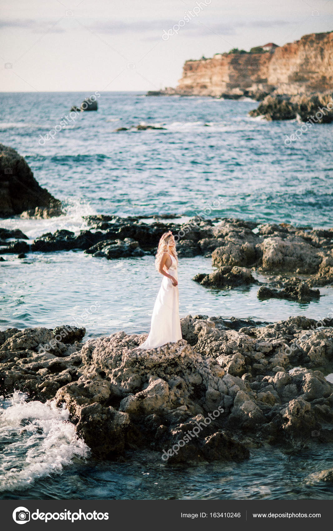Blond Bride Posing On Rocks Near The Sea Delicate And Sincere