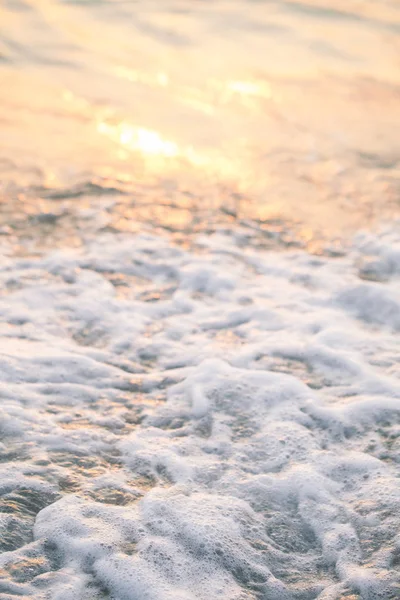 Close up sea foam at sunset — Stock Photo, Image