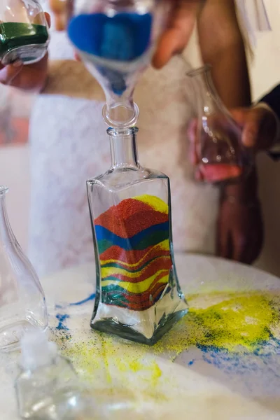 On the table is a bottle of colored sand — Stock Photo, Image