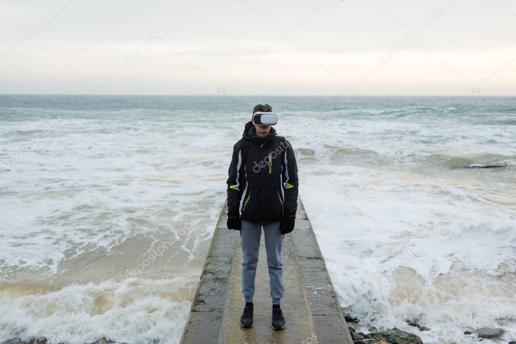 guy learns virtual reality by the sea